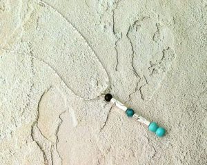 Elegant turquoise, howlite and obsidian pendant