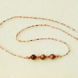 Photo of a 21" goldstone necklace with bright copper chains and hooks