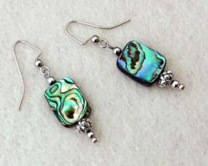 Intricate dangle earrings with abalone shell and carved silver plated beads ~ designed by Motley Mix Jewelry