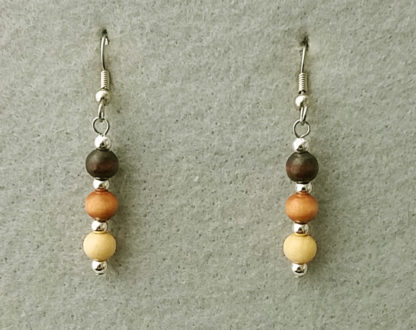 Photo of lightweight stick earrings with natural wooden beads of three different shades of brown by Motley Mix Jewelry