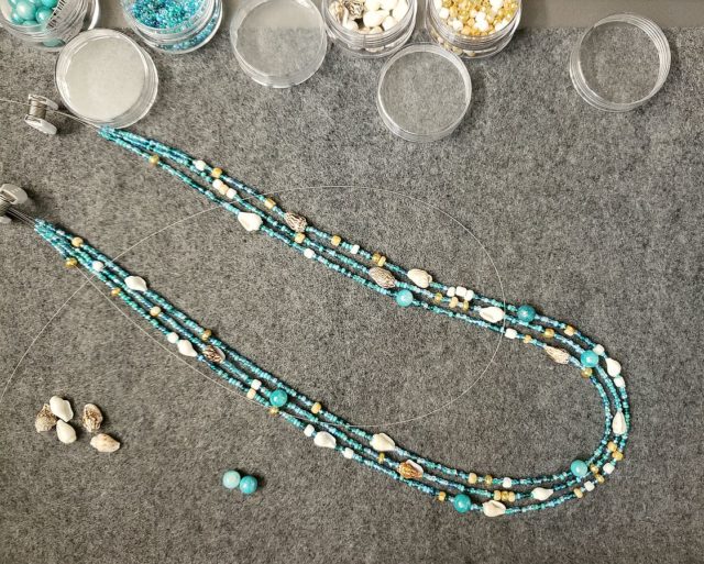 Ocean/beach necklace with nassa shells and glass in progress